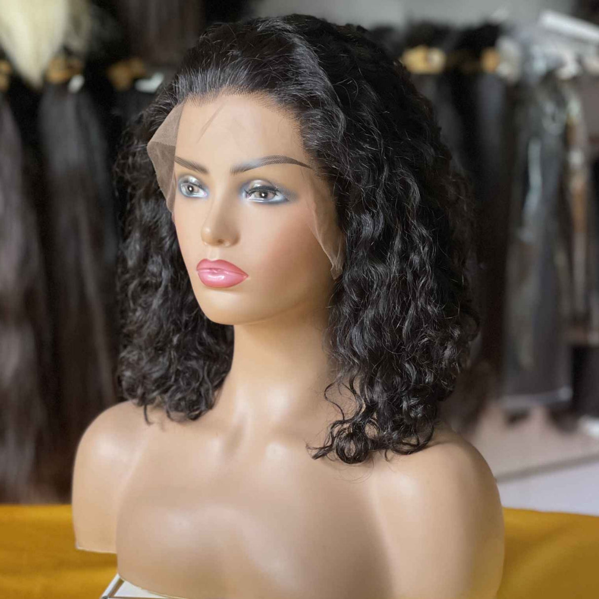QWB Queen Weave Beauty - Detailed texture verification macro photography documenting loose flowing S-shaped water wave pattern with natural bounce. Close inspection reveals uniform curl formation throughout entire strand length from weft edge through tip ends, confirming consistent steam processing