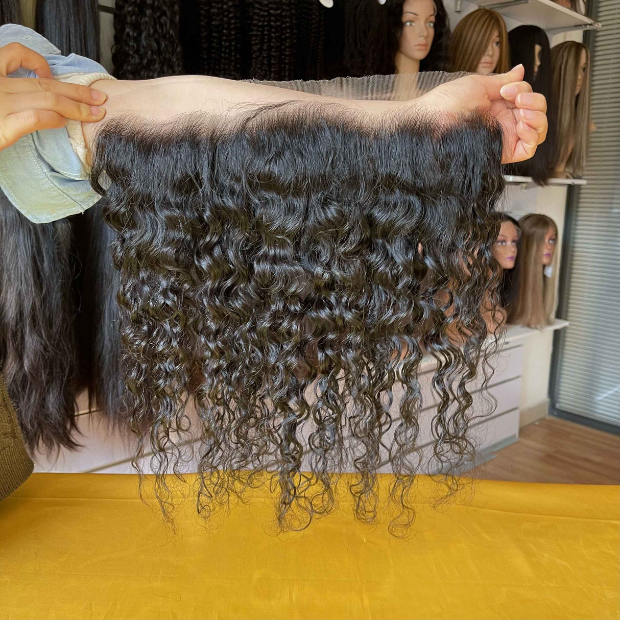 QWB Water Wave 13x4 HD Lace Frontal Side Profile Installation Demonstration - Model wearing water wave frontal showing seamless blend between natural skin tone and transparent HD lace base. Side angle revealing pre-plucked hairline edge detail with strategically placed baby hairs creating realistic