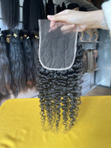 QWB Queen Weave Beauty - Detailed texture verification macro photography documenting distinctive S-pattern tight ringlets with high-volume bouncy texture. Close inspection reveals uniform curl formation throughout entire strand length from weft edge through tip ends, confirming consistent steam proc