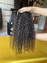 QWB Queen Weave Beauty - Product construction quality documentation showing reinforced weft attachment system. Machine double stitching anchors each hair strand to the base ensuring durability during extended wear periods. Close-up reveals minimal bulk at seam edges for comfortable lay-flat installa