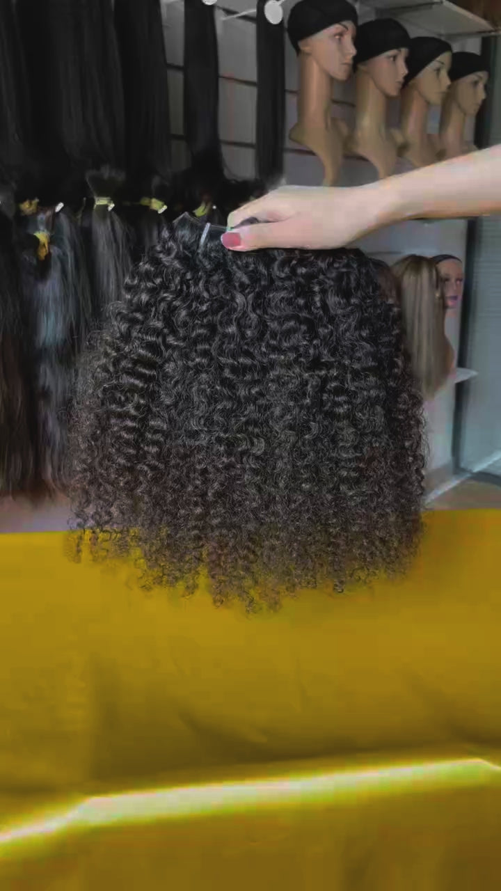 QWB Burmese Curly Donor Hair Close-up - Direct view of 100% donator's virgin hair emphasizing premium quality and unprocessed nature. Tight ringlet texture demonstrates natural curl pattern preserved without chemical alteration. Top grade raw material sourced from young donors for tangle-free perfor