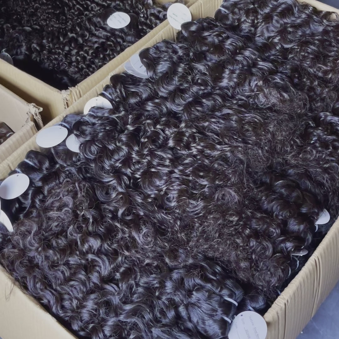 Water Wave Bundles Side Profile View - Natural fit demonstration showing how the substantial weight of loose S-shaped wave bundles lays naturally flat against body without stiffness. Premium virgin human hair cascades with bouncy flowing movement characteristic of unprocessed 100% cuticle intact Bra