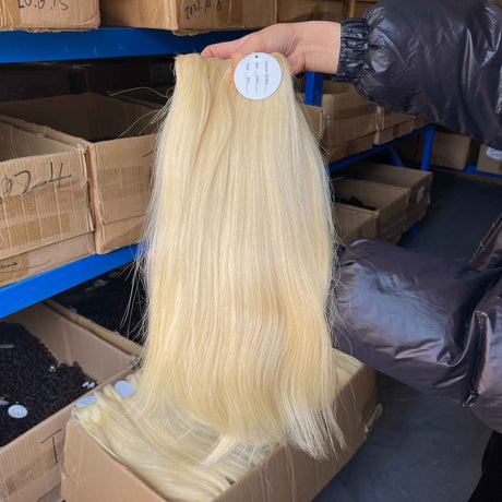 QWB Queen Weave Beauty - Detailed texture verification macro photography documenting premium virgin human hair. Close inspection reveals uniform curl formation throughout entire strand length from weft edge through tip ends, confirming consistent steam processing during manufacturing. Cuticle intact