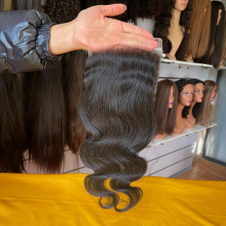 QWB Queen Weave Beauty - Detailed texture verification macro photography documenting premium virgin human hair. Close inspection reveals uniform curl formation throughout entire strand length from weft edge through tip ends, confirming consistent steam processing during manufacturing. Cuticle intact