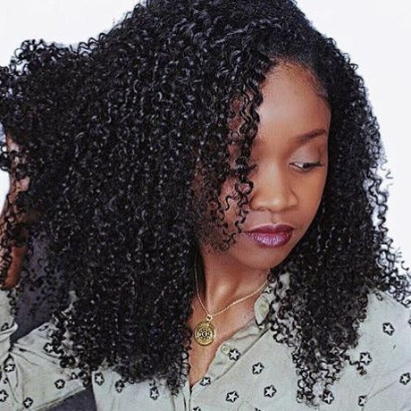 Kinky Curly Lifestyle Photo - Active daily wear example showing hair movement and natural drape of extension bundles with full coverage. Tight uniform ringlet kinky curly texture maintains voluminous appearance throughout extended wear with proper care, suitable for all color applications including 