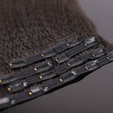 QWB Queen Weave Beauty - Detailed texture verification macro photography documenting coiled steam-processed kinky straight texture (NOT natural afro kinks). Close inspection reveals uniform curl formation throughout entire strand length from weft edge through tip ends, confirming consistent steam pr
