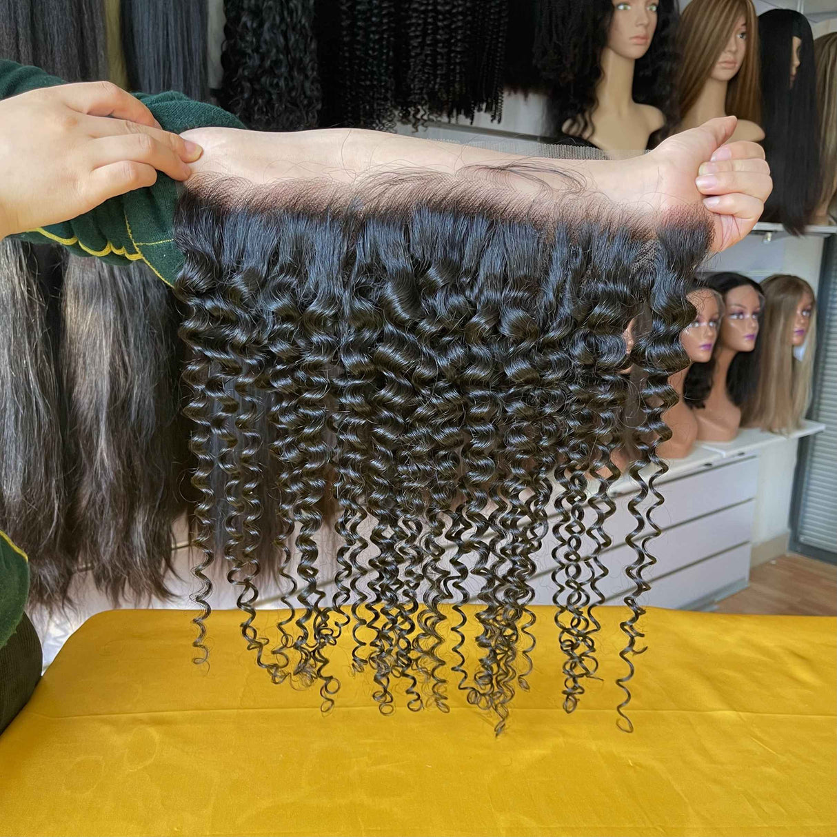 Tight Curly Lace Frontal Side Profile - HD Lace Front Plucked Natural Hairline detail showing seamless blend and natural appearance on model. Springy tight curl pattern maintains volume while transparent lace disappears against skin tone for invisible finish.