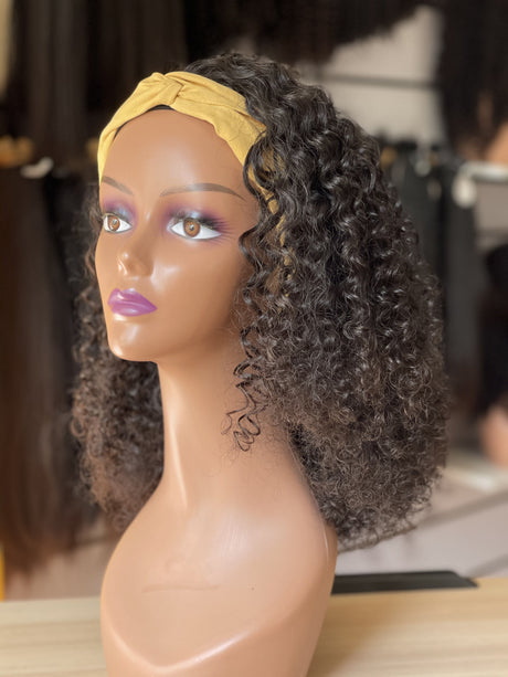 QWB Queen Weave Beauty - Detailed texture verification macro photography documenting compact tight curly ringlet formation with defined spiral coils. Close inspection reveals uniform curl formation throughout entire strand length from weft edge through tip ends, confirming consistent steam processin