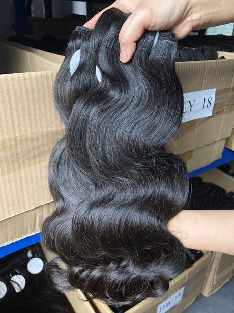 QWB Queen Weave Beauty - Detailed texture verification macro photography documenting premium virgin human hair. Close inspection reveals uniform curl formation throughout entire strand length from weft edge through tip ends, confirming consistent steam processing during manufacturing. Cuticle intact
