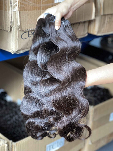 Body Wave Bundle Side Profile View - Natural hang and weight demonstration of premium Brazilian virgin hair extensions. Body wave texture cascades with body and movement, substantial 98-100g weight per bundle lays flat against natural hair while maintaining gentle wave definition.