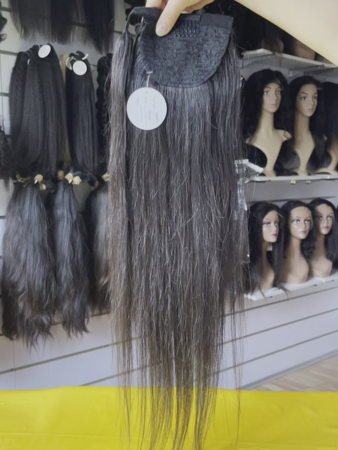 Straight Wrap-Around Drawstring Ponytail Video Demo - Real usage demonstration showing product versatility, quality construction, authentic styling from multiple angles. Video still capturing movement of pin-strand texture proving natural flow rather than stiff appearance, demonstrating wrap-around 