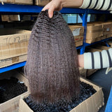 QWB Queen Weave Beauty - Detailed texture verification macro photography documenting coiled steam-processed kinky straight texture (NOT natural afro kinks). Close inspection reveals uniform curl formation throughout entire strand length from weft edge through tip ends, confirming consistent steam pr
