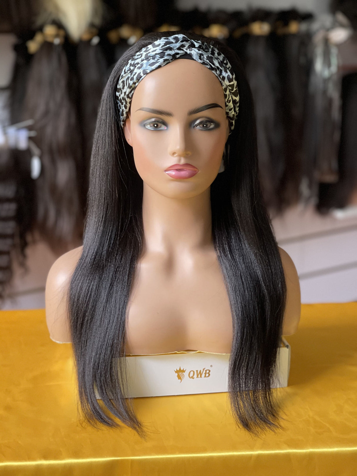 QWB Queen Weave Beauty - Detailed texture verification macro photography documenting hybrid straight-crimped light yaki texture mimicking silk-pressed natural black women's hair. Close inspection reveals uniform curl formation throughout entire strand length from weft edge through tip ends, confirmi
