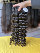 QWB Queen Weave Beauty - Product construction quality documentation showing reinforced weft attachment system. Machine double stitching anchors each hair strand to the base ensuring durability during extended wear periods. Close-up reveals minimal bulk at seam edges for comfortable lay-flat installa