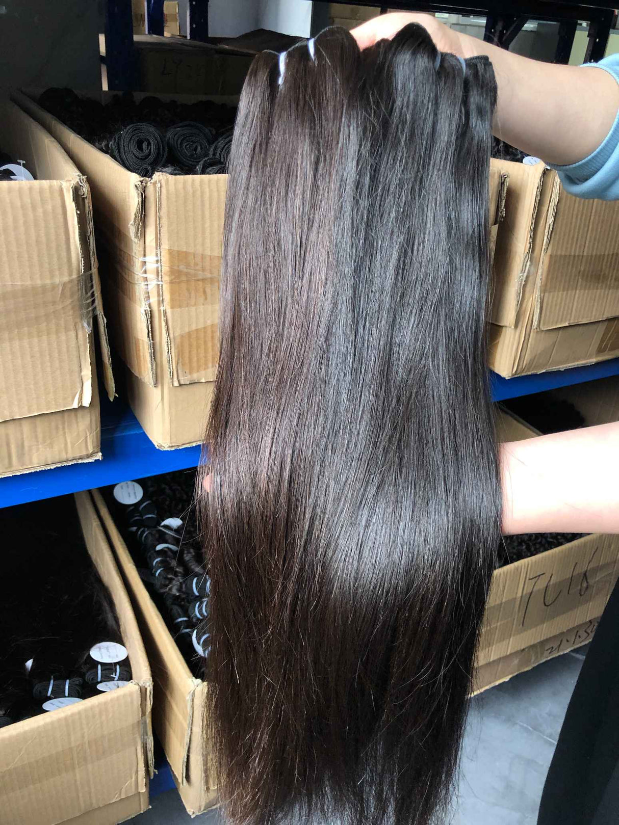QWB Queen Weave Beauty - Detailed texture verification macro photography documenting premium virgin human hair. Close inspection reveals uniform curl formation throughout entire strand length from weft edge through tip ends, confirming consistent steam processing during manufacturing. Cuticle intact