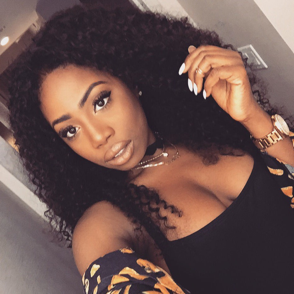 Customer Photo Example #1 - Tight Curly Brazilian Virgin Hair Wig worn by natural texture customer showcasing realistic springy curls and volume. Deep black #1b color demonstrates authentic appearance when styled with proper care on real users.